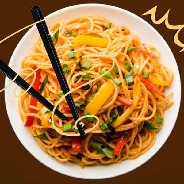 A white bowl of Indian noodles with colorful bell peppers, green onions, and black chopsticks.